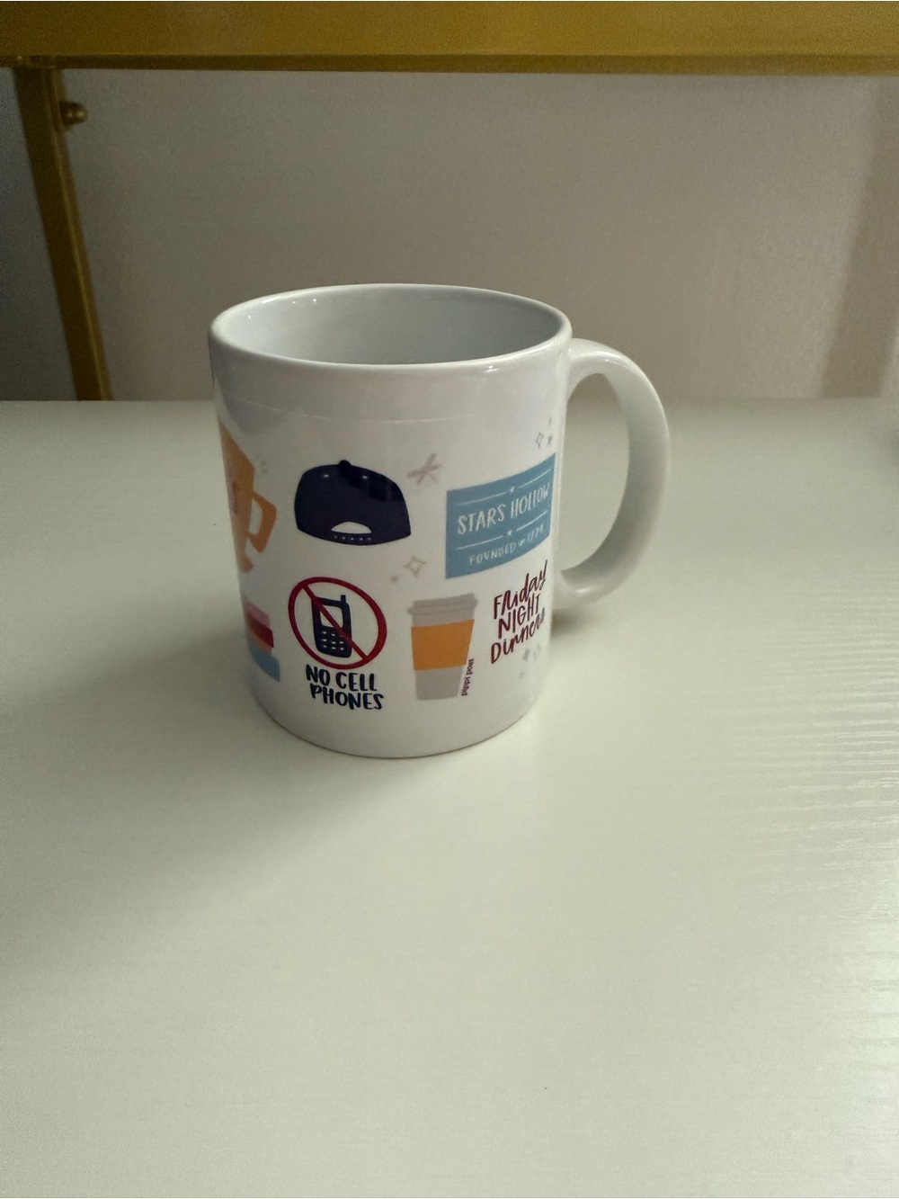 White Ceramic Graphic Coffee Mug with Blue and Orange Accents